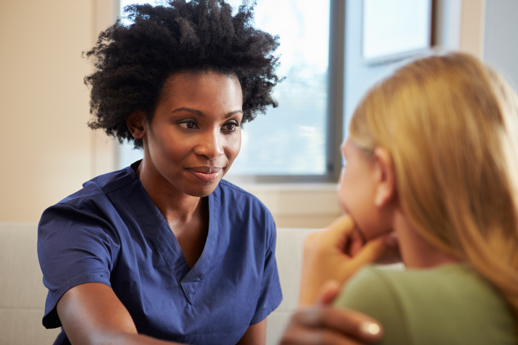Nurse Treating Teenage Girl
